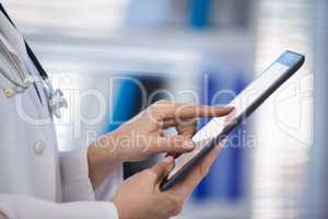 Doctor using digital tablet