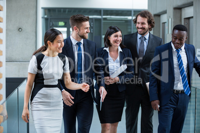 Businesswomen walking with colleagues