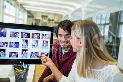 Graphic designers working over laptop