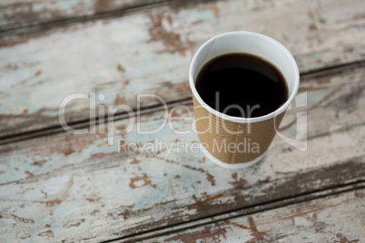 Cup of black coffee on wooden table