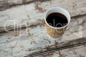 Cup of black coffee on wooden table