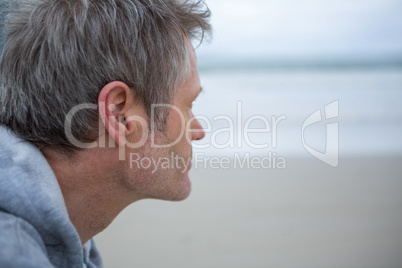 Close-up of thoughtful man on beach