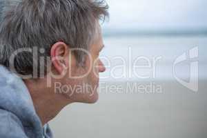 Close-up of thoughtful man on beach