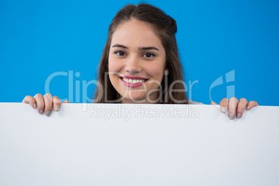 Woman holding a blank placard