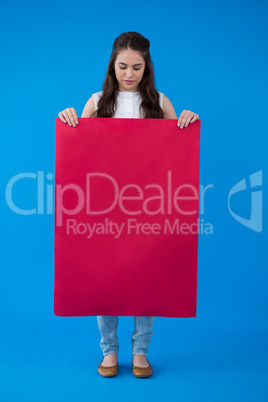 Woman holding a blank placard