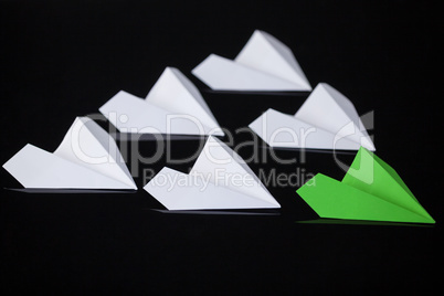 Paper airplanes arranged together