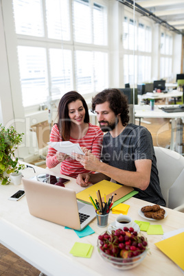 Graphic designers working at desk