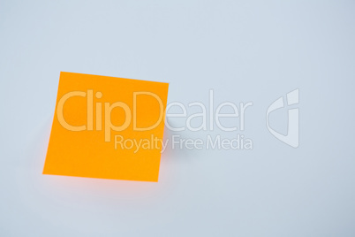 Close-up of orange adhesive note