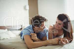 Romantic couple relaxing on bed