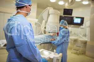 Surgeons examining patient in operation theater