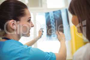 Female nurse discussing x-ray report with patient