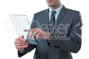 Businessman using futuristic digital tablet