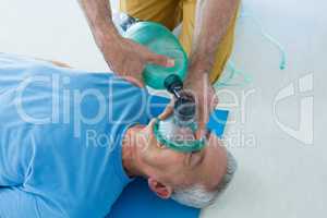 Paramedic performing resuscitation on patient