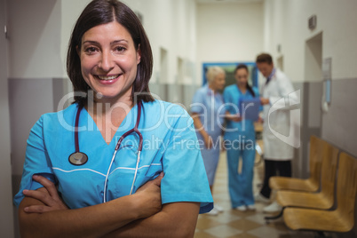 Portrait of female surgeon standing in corridor