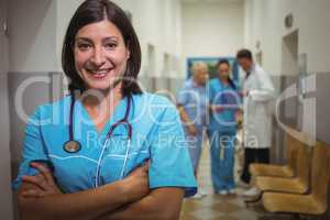 Portrait of female surgeon standing in corridor