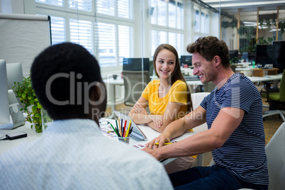 Graphic designers working at desk