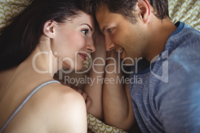 Romantic couple relaxing on bed