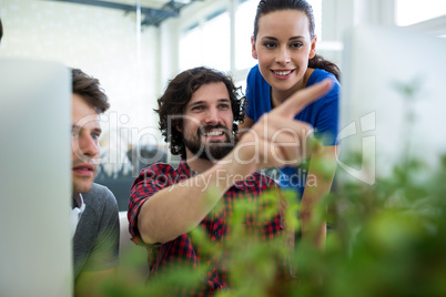 Team of graphic designers working at desk