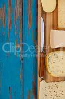 Various cheese on wooden board