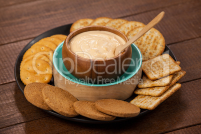 Biscuits with cheese sauce in plate