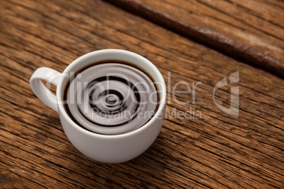 Cup of coffee on wooden table