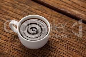 Cup of coffee on wooden table