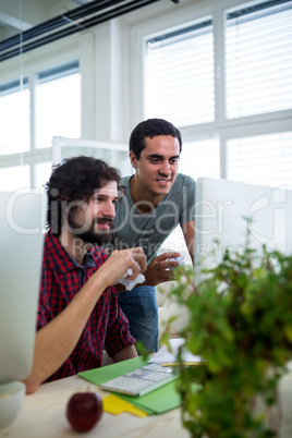 Graphic designers working at desk