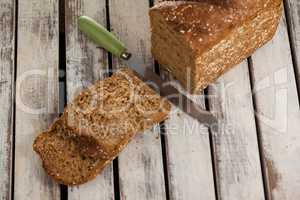 Sliced bread loaf with knife