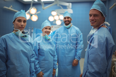 Portrait of surgeons standing in operation theater