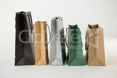 Various paper shopping bags in row