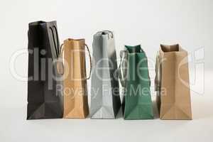 Various paper shopping bags in row