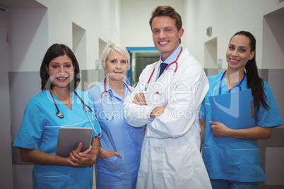 Team of doctors standing in corridor