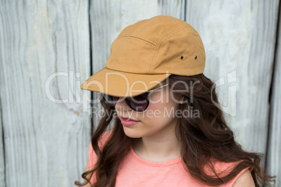 Woman in brown cap and sunglasses