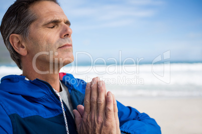 Mature man performing yoga