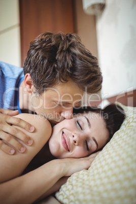 Romantic couple relaxing on bed