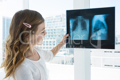 Girl looking at x-ray report