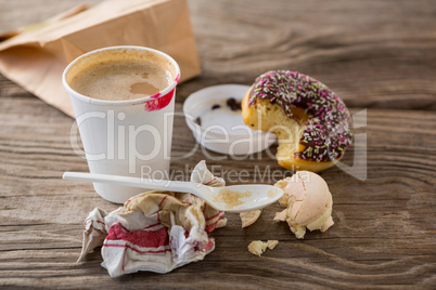 Leftover doughnut and macaroon with coffee