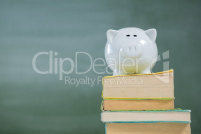 Piggy bank on stack of books