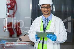 Technician holding digital tablet