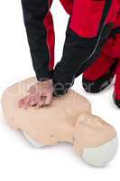 Paramedic practising resuscitation on dummy