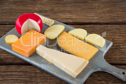 Variety of cheese on chopping board