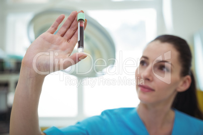 Nurse looking at the blood sample