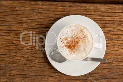 Cup of espresso coffee on wooden table