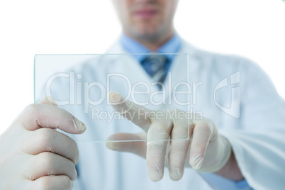 Male doctor using an futuristic digital tablet