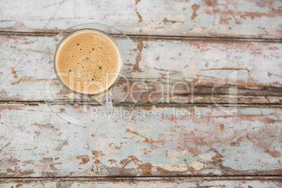 Cup of coffee on wooden table