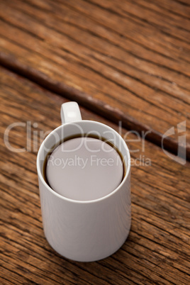 Cup of coffee on wooden table