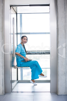 Nurse sitting and holding her diary