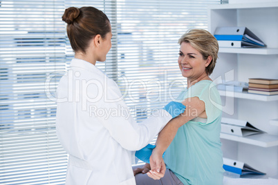 Doctor giving injection to patient
