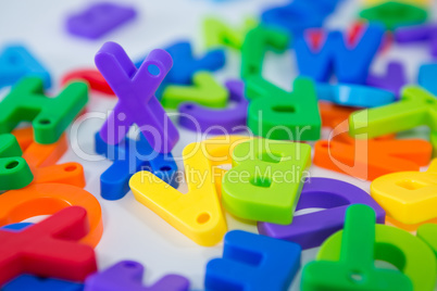 X alphabet standing between toy alphabet