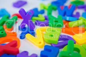 X alphabet standing between toy alphabet
